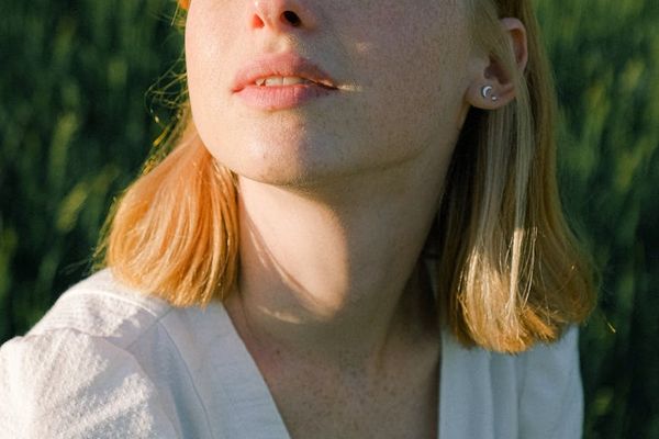 Person breathing deeply with eyes closed.